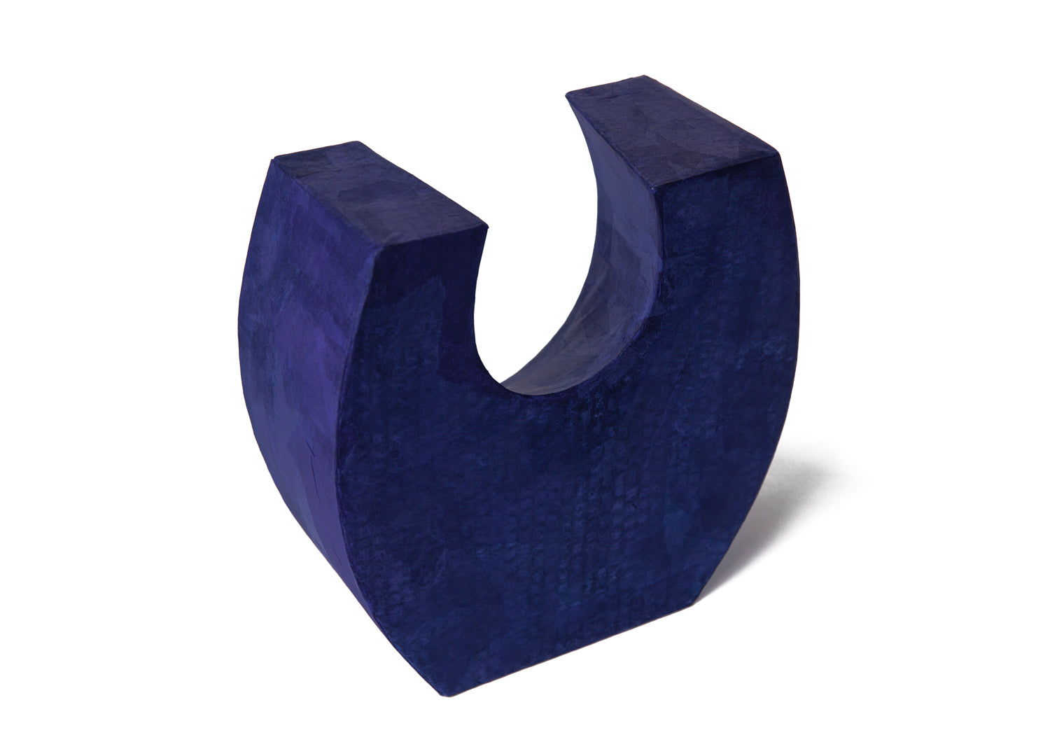 Picture of a beautiful purple horseshoe shaped biodegradable paper cremation urn on sale at Muses Design Urns. Back view.