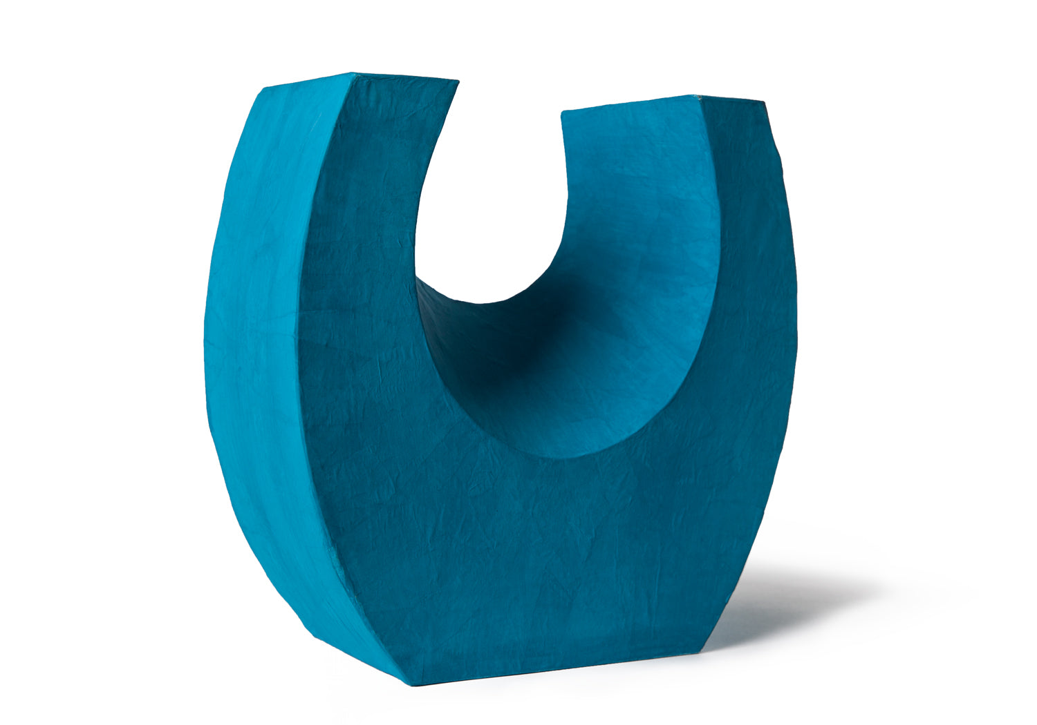 Picture of a beautiful aqua horseshoe shaped biodegradable paper cremation urn on sale at Muses Design Urns. Back view.