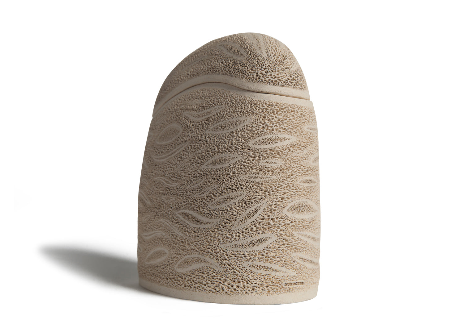 Picture of a beige ceramics (faience) monolith shaped cremation urn on sale at Muses Design Urns. Right side view.