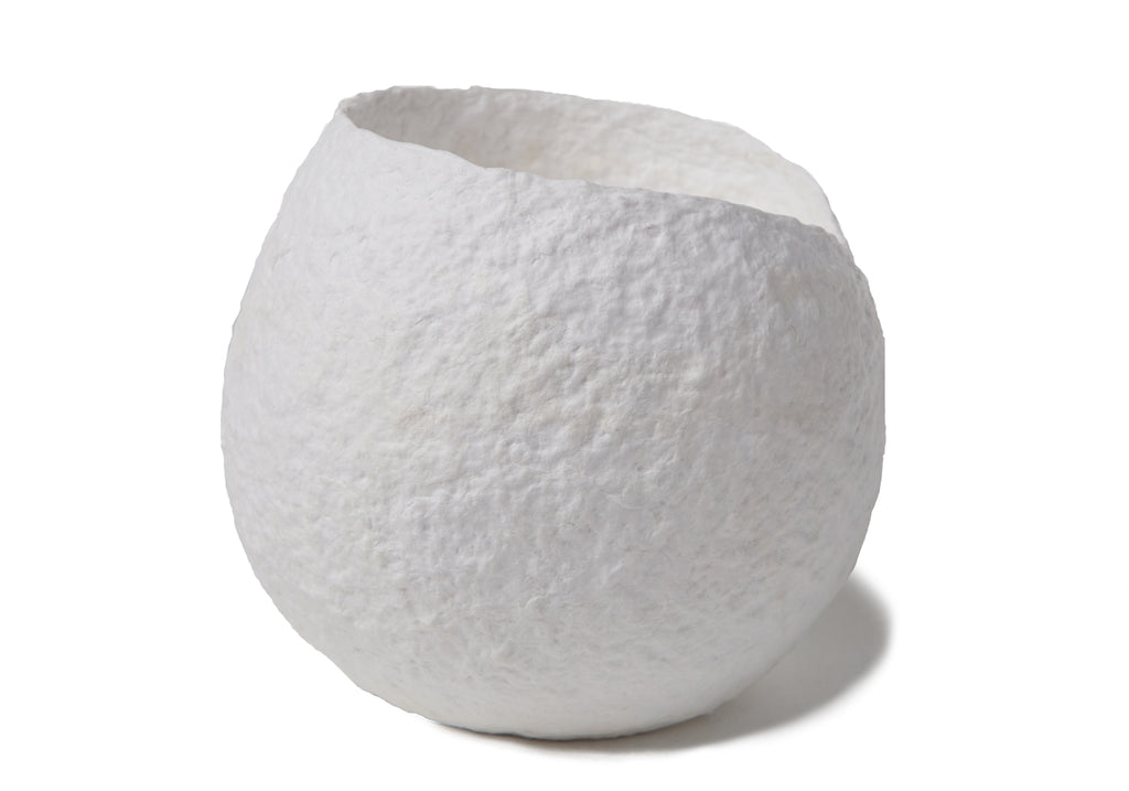 Picture of a white round shape biodegrdable coton fibre cremation urn for children on sale at Muses Design Urns. Side view.