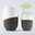 Picture of an biodegradable cremation urn that becomes a tree and made of coffee grouds. Duo view.